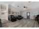 Living room showcasing neutral paint, plank flooring, and an exterior entrance at 11806 Sw 61St Place Rd, Ocala, FL 34481
