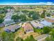 Beautiful aerial view of the home, its landscaping, and the surrounding golf course community at 11945 Se 171St Loop, Summerfield, FL 34491