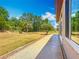Expansive backyard view with a decorative walkway on a sunny day at 11945 Se 171St Loop, Summerfield, FL 34491