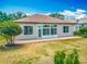 A well maintained lawn extends from the back patio of this delightful house at 11945 Se 171St Loop, Summerfield, FL 34491