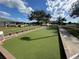 Bocce ball courts featuring well-maintained green surfaces and wooden boundaries, ready for a friendly game at 11945 Se 171St Loop, Summerfield, FL 34491