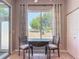 Bright breakfast nook featuring window, table, and chairs, creating a perfect space for casual dining at 11945 Se 171St Loop, Summerfield, FL 34491