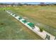 Community driving range featuring multiple stations for golf practice at 11945 Se 171St Loop, Summerfield, FL 34491