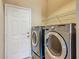 Laundry room featuring a washer and dryer at 11945 Se 171St Loop, Summerfield, FL 34491