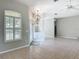 Open living area featuring tile floors, a decorative light fixture and a ceiling fan at 11945 Se 171St Loop, Summerfield, FL 34491