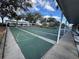 Organized shuffleboard courts with green surfaces and numbered sections, surrounded by benches and trees at 11945 Se 171St Loop, Summerfield, FL 34491