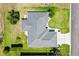 Aerial view showcases the home's roof and landscaped yard at 12147 Se 173Rd Pl, Summerfield, FL 34491