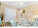 Comfortable bedroom with a large closet, opening up to the dining area at 12147 Se 173Rd Pl, Summerfield, FL 34491