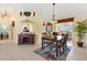 Elegant dining room featuring a classic table set and ample space for entertaining at 12147 Se 173Rd Pl, Summerfield, FL 34491
