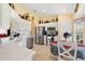 Well-equipped kitchen with stainless steel appliances, white cabinetry, and a breakfast area at 12147 Se 173Rd Pl, Summerfield, FL 34491