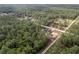 Bird's-eye view of home in a heavily wooded area with long dirt roads at 12689 Sw 81St St, Dunnellon, FL 34432