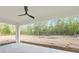 Large covered back porch overlooks the expansive yard with wooded views at 12689 Sw 81St St, Dunnellon, FL 34432