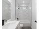 Stylish bathroom with white quartz countertop, matte black fixtures, and tiled bathtub area with window at 12689 Sw 81St St, Dunnellon, FL 34432