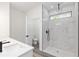 Bathroom featuring double sink vanity with walk-in shower and a view of the toilet at 12689 Sw 81St St, Dunnellon, FL 34432