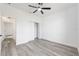 Bedroom with wood-look flooring, neutral walls and a closet at 12689 Sw 81St St, Dunnellon, FL 34432