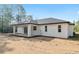 A covered patio enhances the outdoor living experience of this home at 12689 Sw 81St St, Dunnellon, FL 34432