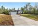Well-maintained single-Gathering home with a concrete driveway and attached two-car garage at 12689 Sw 81St St, Dunnellon, FL 34432