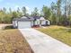 Lovely front exterior of the home with an attached two car garage at 12689 Sw 81St St, Dunnellon, FL 34432