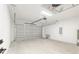 Spacious two car garage with overhead lighting, new garage door, and concrete flooring at 12689 Sw 81St St, Dunnellon, FL 34432
