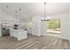 Modern kitchen featuring white cabinets, stainless steel appliances, and an island at 12689 Sw 81St St, Dunnellon, FL 34432