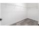 Walk-in closet with built-in wire shelving and wood-look floors at 12689 Sw 81St St, Dunnellon, FL 34432