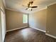 Neutral bedroom with hardwood floors and closet, perfect for a simple and inviting space at 13430 Ne 30Th Ct, Anthony, FL 32617