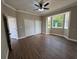 Spacious bedroom features hardwood floors, large windows, and closets, offering a comfortable and inviting atmosphere at 13430 Ne 30Th Ct, Anthony, FL 32617