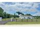 Stunning single-story home with well maintained landscaping and charming rustic fence at 13430 Ne 30Th Ct, Anthony, FL 32617