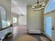 Elegant foyer with hardwood floors, a stylish chandelier, and an open floor plan, creating a grand entrance at 13430 Ne 30Th Ct, Anthony, FL 32617