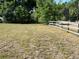 Expansive grassy lot with a wooden fence, perfect for outdoor activities or future development at 13430 Ne 30Th Ct, Anthony, FL 32617