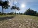 A grassy lot under a blue, partly cloudy sky has plenty of space for building at 13430 Ne 30Th Ct, Anthony, FL 32617