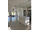 Bright kitchen featuring a center island with quartz countertops and stainless steel appliances at 14173 Se 41St Ter, Summerfield, FL 34491