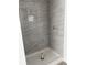 Modern tiled shower with neutral tones and a sleek design, ready for finishing touches at 14173 Se 41St Ter, Summerfield, FL 34491
