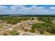 Aerial image displaying the property's layout and its integration within the expansive neighborhood and nearby lake at 14555 Se 98Th Ave, Summerfield, FL 34491