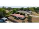 Drone shot of the home with mature landscaping, metal roof, and proximity to neighborhood amenities at 14555 Se 98Th Ave, Summerfield, FL 34491