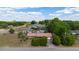 Aerial view of a ranch-style home featuring lush landscaping and a backyard pool at 14555 Se 98Th Ave, Summerfield, FL 34491