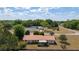 An aerial view displaying a single Gathering residence with established landscaping, and mature trees at 14555 Se 98Th Ave, Summerfield, FL 34491