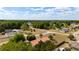 An aerial view highlighting the residence with mature landscaping and proximity to the surrounding neighborhood at 14555 Se 98Th Ave, Summerfield, FL 34491