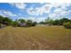 Expansive backyard showcasing the home's generous lot size, perfect for outdoor activities at 14555 Se 98Th Ave, Summerfield, FL 34491