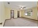 Spacious main bedroom with large window and two doorways to the ensuite at 14555 Se 98Th Ave, Summerfield, FL 34491