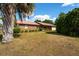 Charming single-story brick home with an attached two-car garage and a well-maintained lawn at 14555 Se 98Th Ave, Summerfield, FL 34491