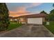Charming single-story brick home with an attached two-car garage and a well-maintained lawn at 14555 Se 98Th Ave, Summerfield, FL 34491
