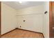 This is a practical laundry room with shelving and laminate wood-look flooring at 14555 Se 98Th Ave, Summerfield, FL 34491