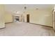 View of the spacious living room with sliding glass doors to the patio, adjoining the kitchen, perfect for entertaining at 14555 Se 98Th Ave, Summerfield, FL 34491