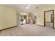 Cozy living room with access to a screened patio and kitchen, creating an easy flow for daily living at 14555 Se 98Th Ave, Summerfield, FL 34491