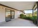 Covered patio perfect for enjoying the outdoors, seamlessly extending the indoor living space at 14555 Se 98Th Ave, Summerfield, FL 34491