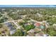 Aerial view of a neighborhood, showcasing homes with pools and lush green landscaping at 15640 Sw 48 Ave, Ocala, FL 34473