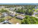 An aerial view of a suburban neighborhood, highlighting the community layout and surrounding greenery at 15640 Sw 48 Ave, Ocala, FL 34473