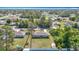Aerial view of homes in a quiet neighborhood featuring spacious yards and tree-lined streets at 15640 Sw 48 Ave, Ocala, FL 34473