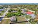 An aerial shot reveals a serene neighborhood with well-maintained homes and green spaces at 15640 Sw 48 Ave, Ocala, FL 34473